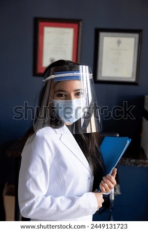 Young health care professional woman in personal protective equipment