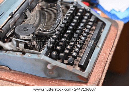 Old typewriter. Portable printing device, working copy. Royalty-Free Stock Photo #2449136807