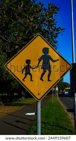 Yellow road sign for pedestrians.Sydney  Australia