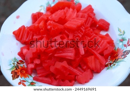 red sweet cake made from unripe papaya