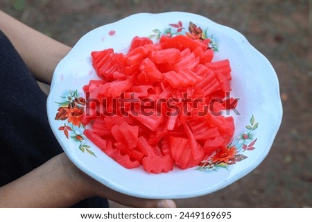 red sweet cake made from unripe papaya