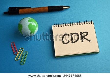 There is notebook with the word CDR. It is an abbreviation for Carbon Dioxide Removal as eye-catching image. Royalty-Free Stock Photo #2449174685