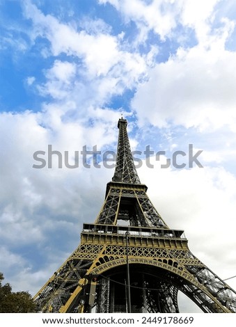 A beautiful picture of the Eiffel Tower in Paris, the capital of France, with a wonderful background in wonderful natural colors