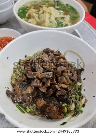 Mien Ngan Xao or stir-fried glass noodles with muscovy duck meat, a famous dish in Hanoi, Vietnam. 