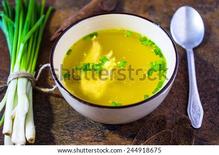 Chicken broth soup with herbs
