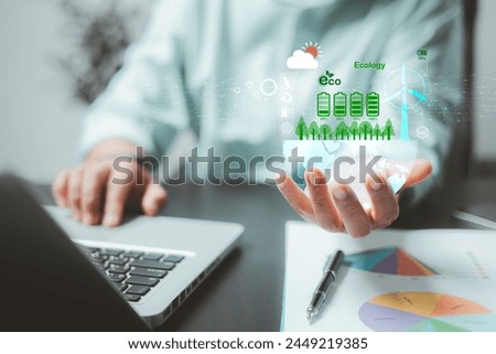 Business industry is increasingly adopting sustainable practices to reduce carbon emissions and preserve the ecology of the Earth, emphasizing the importance of eco-friendly energy solutions. Royalty-Free Stock Photo #2449219385