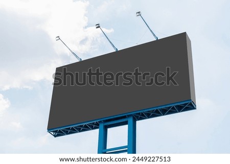 Outdoor pole billboard with blue sky background