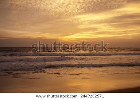 picture of sea waves and sunset