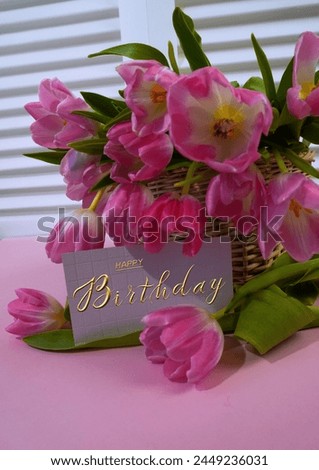 postcard , Internet banner  with a birthday greeting, with the inscription - happy birthday, a bouquet of flowers with a note of congratulations, tulips                               