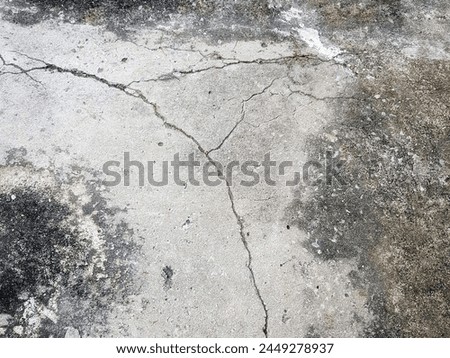 a photography of a fire hydrant on a cement surface.