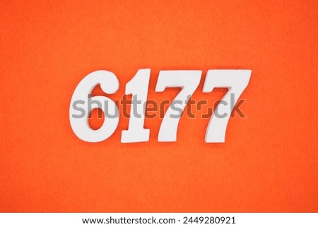 Orange felt is the background. The numbers 6177 are made from white painted wood.