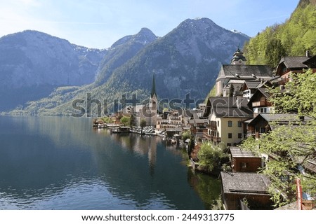 This picture is in Austria Hallstatt this is one of the landmark . with a beautiful lakes mountain and a church when you see this picture, you have a good feeling ￼￼￼￼