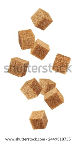 Falling Brown cane sugar cubes isolated on white background, clipping path, full depth of field Royalty-Free Stock Photo #2449318755