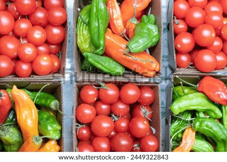 Farm Fresh: Chili Peppers and Cherry Tomatoes for Sale Full Frame in 4K Photo