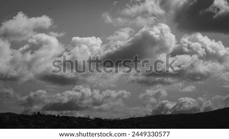25.03.2024. Kragujevac, Serbia. A Black and White Valley, Contrasts of Nature: Dancing Clouds over Landscape.