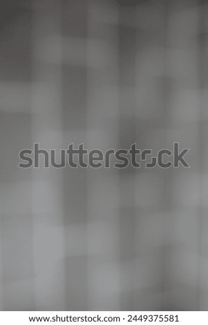 A blurry dreamy grey grid background with white lines.