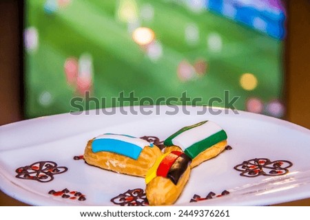 Culture of Faith, Olympic french eclair, World Flags food photography, shot is selective focus with shallow depth of field, taken at lemeridien hotel, Cairo Egypt