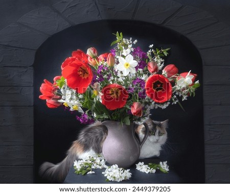 Bouquet of spring flowers in vase and curious kitty
