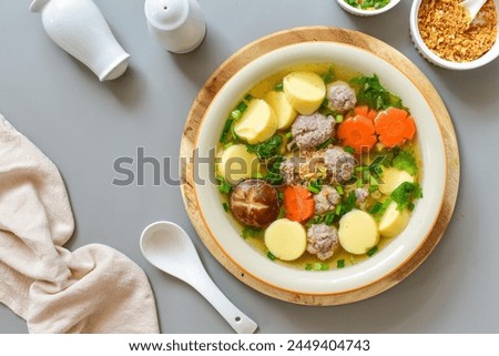 Clear Soup with Bean Curd and Minced Pork and seaweed , top view food,Clear Soup with Egg Tofu ,vegetable and Minced Pork ball ,thai food,Thai call kang jued tao hoo moo sab