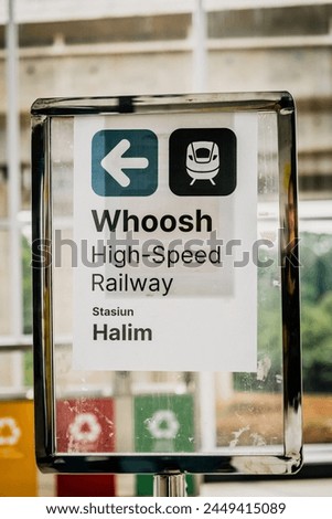 Directional sign to the Whoosh fast train station at Halim Station, Jakarta.