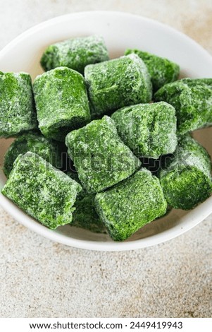 frozen spinach portion cube semifinished fresh food tasty healthy eating cooking meal snack on the table copy space food background rustic top view keto or paleo diet vegetarian vegan food Royalty-Free Stock Photo #2449419943