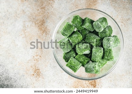 frozen spinach portion cube semifinished fresh food tasty healthy eating cooking meal snack on the table copy space food background rustic top view keto or paleo diet vegetarian vegan food Royalty-Free Stock Photo #2449419949