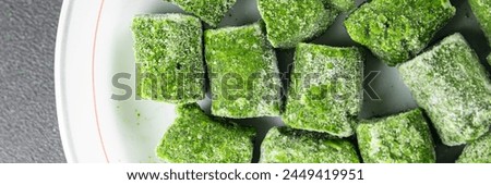 frozen spinach portion cube semifinished fresh food tasty healthy eating cooking meal snack on the table copy space food background rustic top view keto or paleo diet vegetarian vegan food Royalty-Free Stock Photo #2449419951