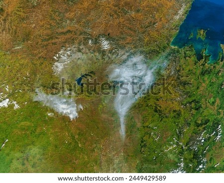 Fires and smoke in Eastern Russia. . Elements of this image furnished by NASA.
