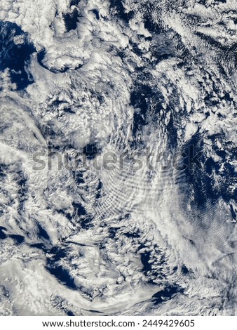 Shipwaveshaped wave clouds induced by the Prince Edward Islands, south Indian Ocean afternoon ove. Shipwaveshaped wave clouds induced by. Elements of this image furnished by NASA.