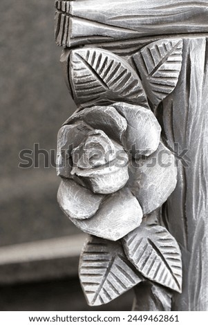 
Decorative element in the shape of a rose on the fence in an old castle.