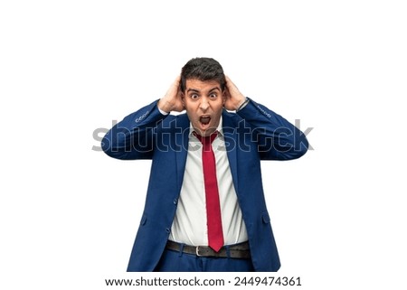 sheer terror and disbelief on the face of a businessman as he holds his head in his hands, mouth agape in a state of shock.  embodies fear and panic, startled by unexpected events white background Royalty-Free Stock Photo #2449474361