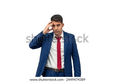 emorseful expression of a businessman as he places his hand on his temple, displaying guilt and regret for his irresponsibility. With a culpable demeanor,  embodies remorse and regret white background Royalty-Free Stock Photo #2449474389