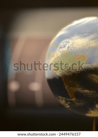 Planet Earth replica in spacial center to learn about the planets and solar system. Third planet from the sun, only place in universe to host life.  Royalty-Free Stock Photo #2449476157