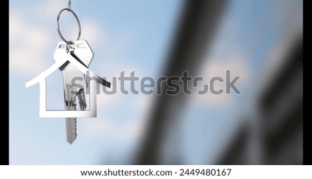Image of keys with house keychain over blurred background. Moving house and digital interface concept digitally generated image.