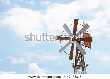 infrared image of an old vintage metal windmill.