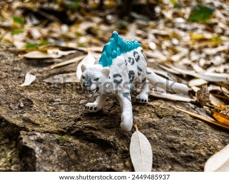 Ferocious tiger on a stone abstract and nature landscape Royalty-Free Stock Photo #2449485937