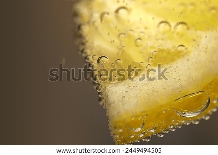 A slice of lemon enhances drinks with its refreshing citrus flavor and vibrant aroma. Whether in water, cocktails, or tea, it adds a delightful twist to every sip, elevating the drinking experience.