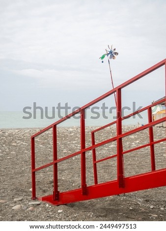 Weather vane and lifeguard booth on the beach. Beach vibe. Resort place by the sea