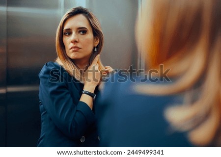 
Professional Woman Arranging her Hair in an Elevator Mirror. Businesswoman caring for her physical appearance being a perfectionist
 Royalty-Free Stock Photo #2449499341