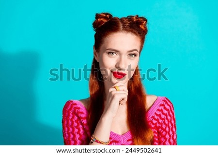 Photo of cute tricky lady dressed pink knitted shirt arm chin smiling isolated blue color background Royalty-Free Stock Photo #2449502641