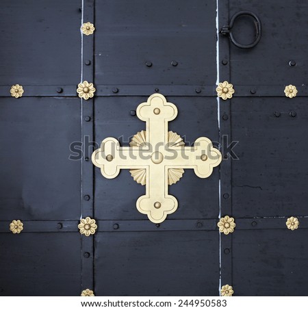 cross on the door in the old Orthodox Church