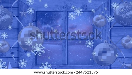 Image of snowflakes over window with baubles and winter landscape. Christmas, tradition and celebration concept digitally generated image.