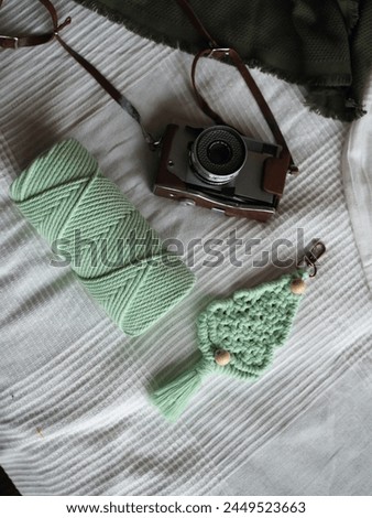 Camera cotton cord and Keychain on Bed