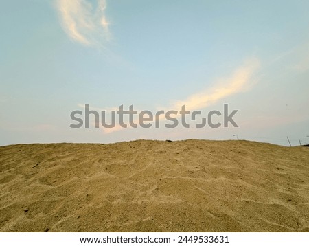 Background sunset sky sand brown sand landscape Royalty-Free Stock Photo #2449533631