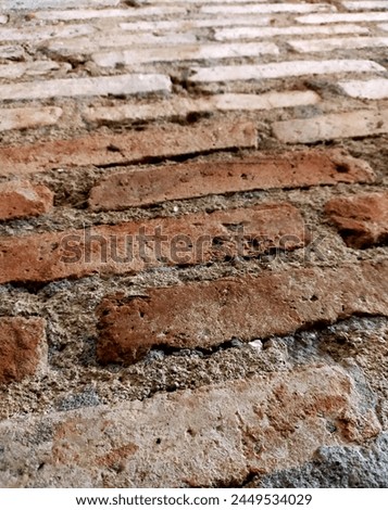 red brick walls, red bricks are one of the basic materials for building a house or a barrier which is constructed using cement Royalty-Free Stock Photo #2449534029