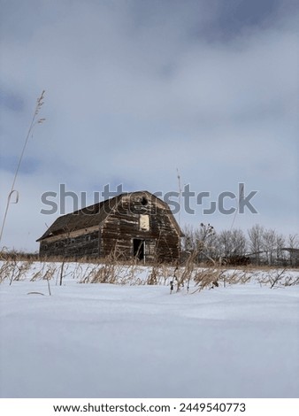 picture of an abandoned farm warehouse in Saskatchewan, Canada, in the winter