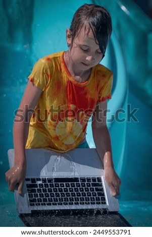 Invalidating and cleaning cache memory concept. Humorous portrait of young girl washes her laptop in the water.  Royalty-Free Stock Photo #2449553791