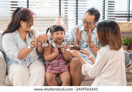 Portrait of happy love asian big family father and mother with asian baby and little girl happy birthday, party, celebration, cake, surprise, grandmother smiling together.Family party