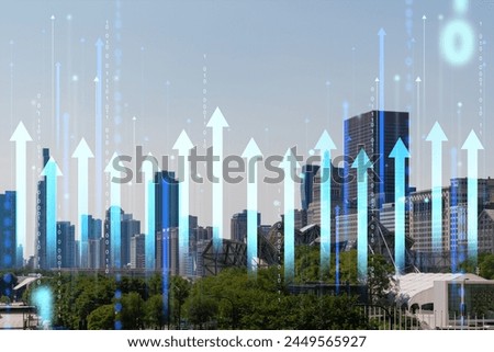 A city skyline with digital holographic arrows and binary code superimposed, indicating growth and futuristic concepts. Double exposure Royalty-Free Stock Photo #2449565927