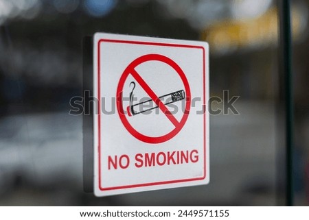 Sign no smoking cigarette in public place. Stop smoking. no smoking sign on the glass. photo of no smoking sticker on restaurant window.